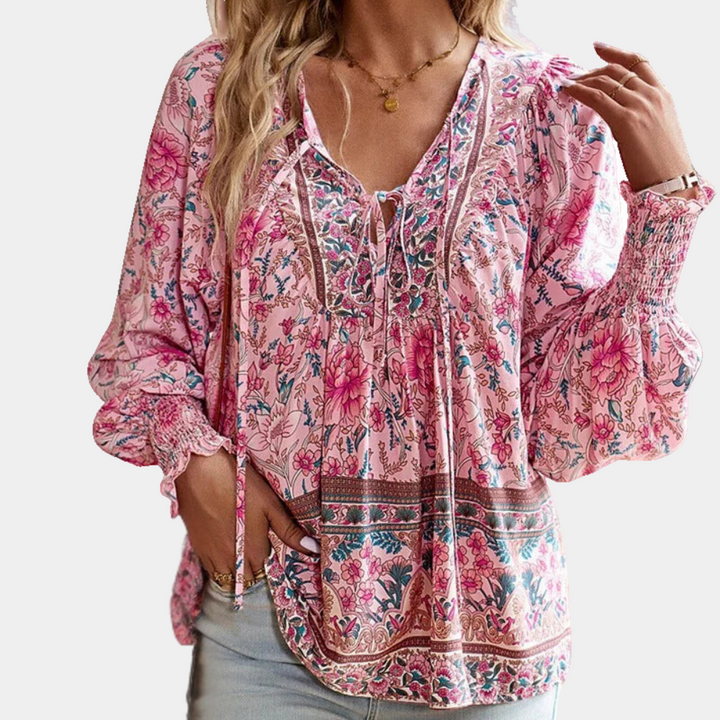Fashionable women's floral print blouse, an elegant long-sleeve top perfect for versatile spring style.