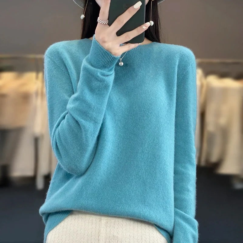 Elegant women's knit long sleeve sweater, a classic and cozy apparel for winter comfort.