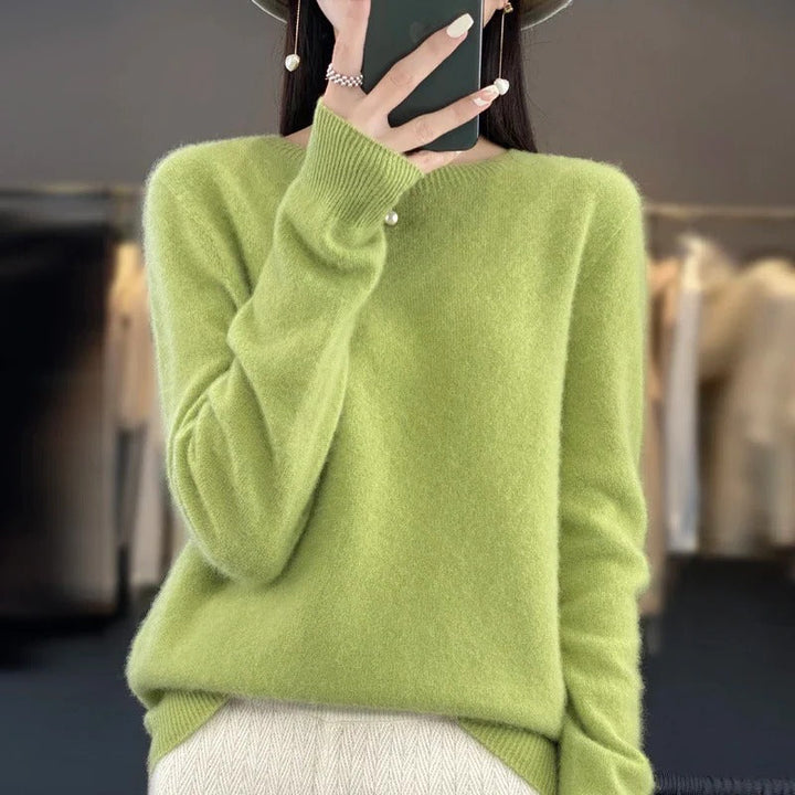Women's elegant long sleeve knit top, a versatile and comfortable sweater for cooler seasons.