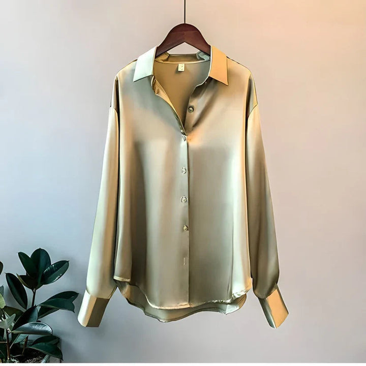 Stylish women's long sleeve office blouse. Elegant, loose fit design for comfortable and professional workwear.