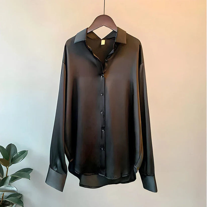 Comfortable women's elegant long sleeve blouse. Loose fit professional office top, ideal for daily work attire.