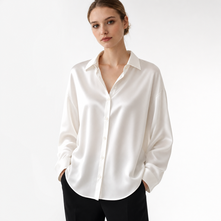 Fashionable women's elegant long sleeve blouse. Versatile loose fit top, suitable for office and casual wear.