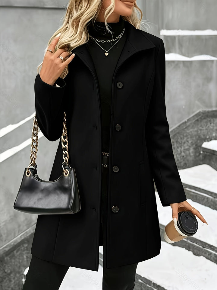 Grey women's elegant longline coat with notch collar. A stylish single-breasted winter jacket.