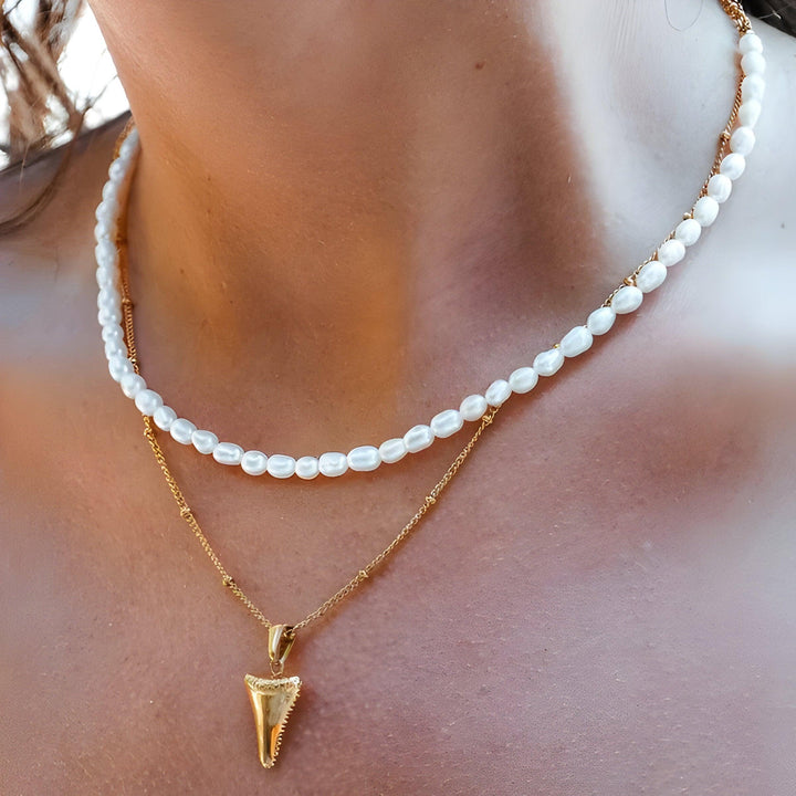 Women's elegant Lunaria freshwater pearl necklace. Handcrafted celestial design, timeless accessory for a stylish look.
