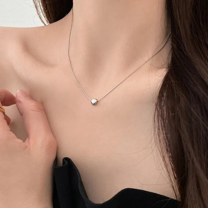 Elegant minimalist heart necklace, sleek & dainty design. Ideal women's jewelry gift, gold or silver.