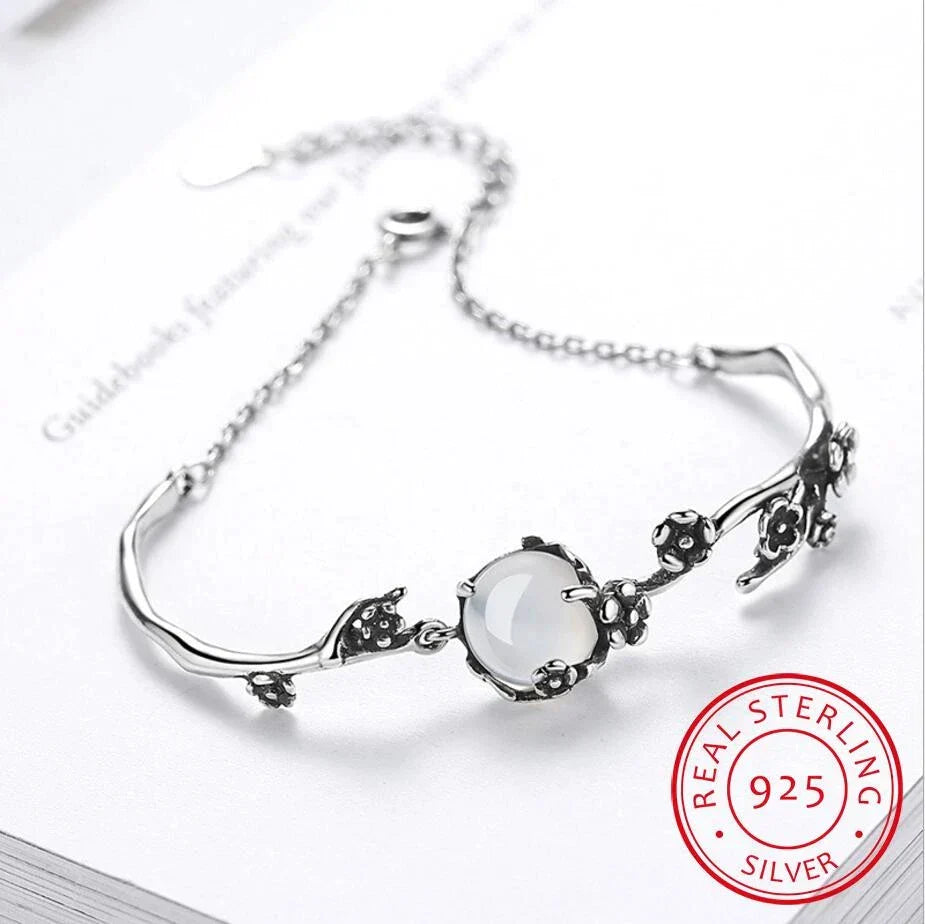 Timeless women's elegant moonstone bracelet in polished sterling silver, perfect accessory for any occasion.