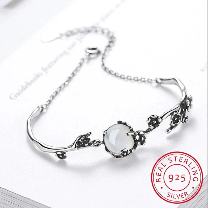 Timeless women's elegant moonstone bracelet in polished sterling silver, perfect accessory for any occasion.