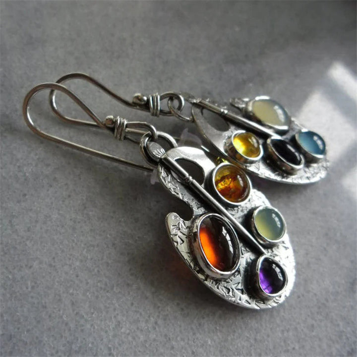 Stylish multicolored stone pendant earrings for women. Sparkling and elegant silver jewelry, ideal for any outfit.