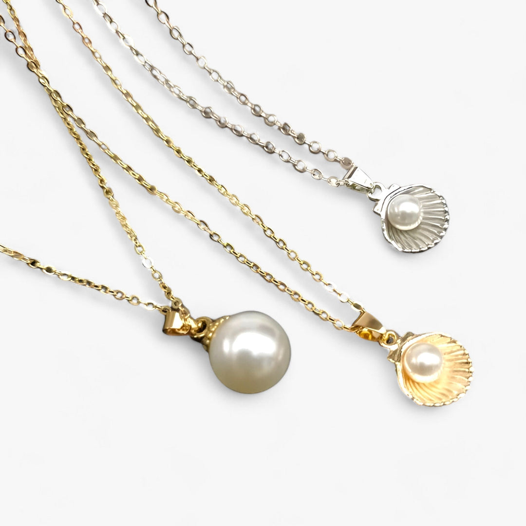 Women's elegant ocean charm necklace with genuine pearls & natural seashells, perfect for summer beach style.