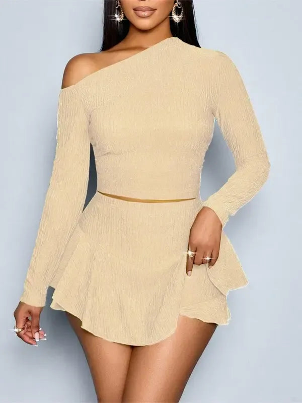 Women's stylish one-shoulder matching set with a form-fitting top and bodycon mini skirt. Elegant stretch fabric.