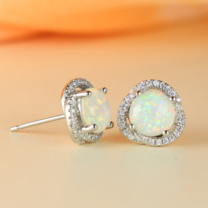 Fashionable women's stud earrings with a unique opal & zircon clover leaf design.