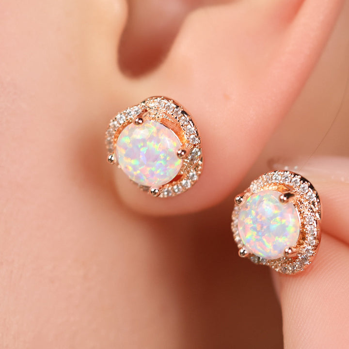 Delicate rose gold women's stud earrings, clover leaf design with white opal & zircon.