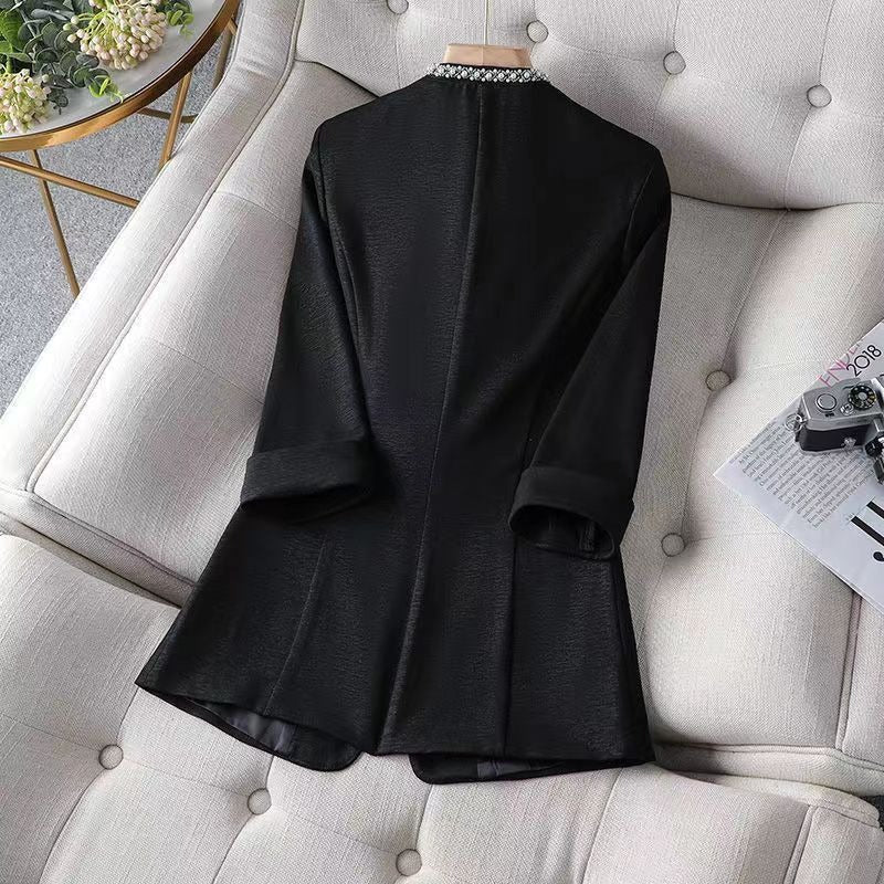 Versatile women's elegant open front blazer with pearl details. A sophisticated jacket for any occasion.