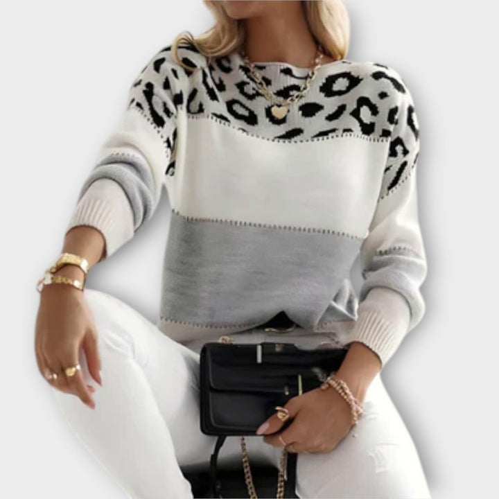 Women's elegant panther print sweater, a stylish knit top perfect for cozy winter fashion.