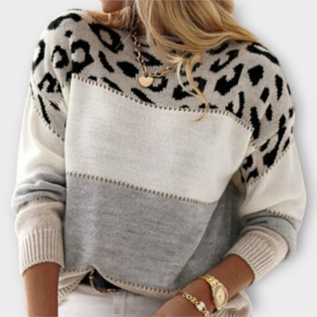 Fashionable women's animal print sweater featuring an elegant panther design for a stylish look.