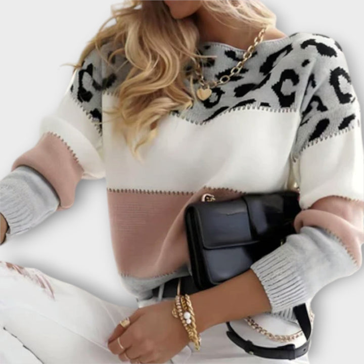 Elegant women's knit sweater showcasing a bold panther print, perfect for adding flair to any ensemble.