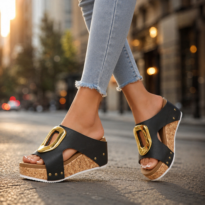 Gold accented women's platform wedges, elegant and comfortable footwear for summer.