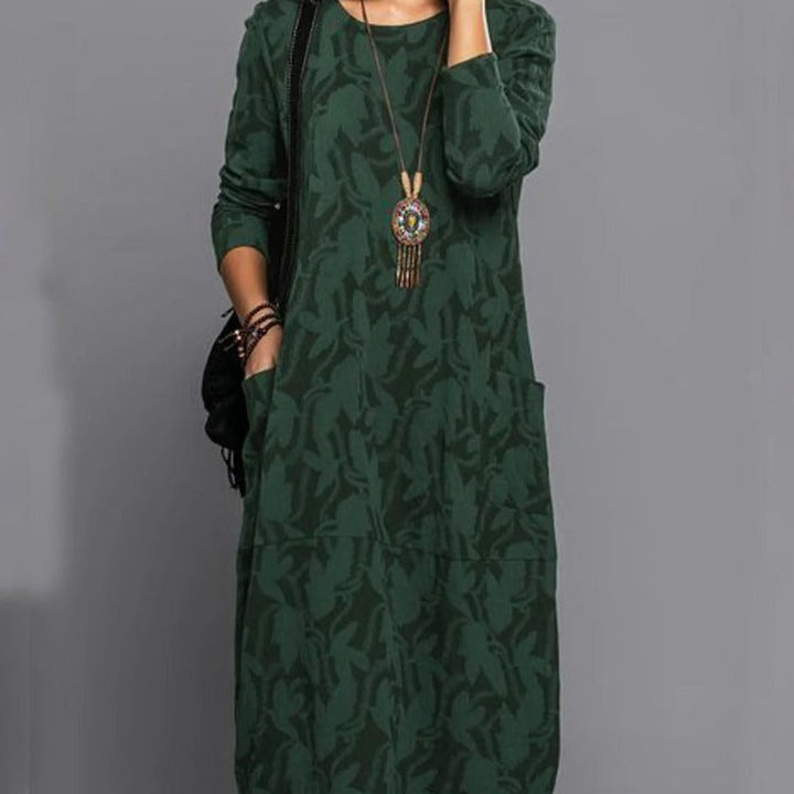 Comfortable women's long-sleeve midi dress featuring a stylish print and practical pockets. Versatile fashion.