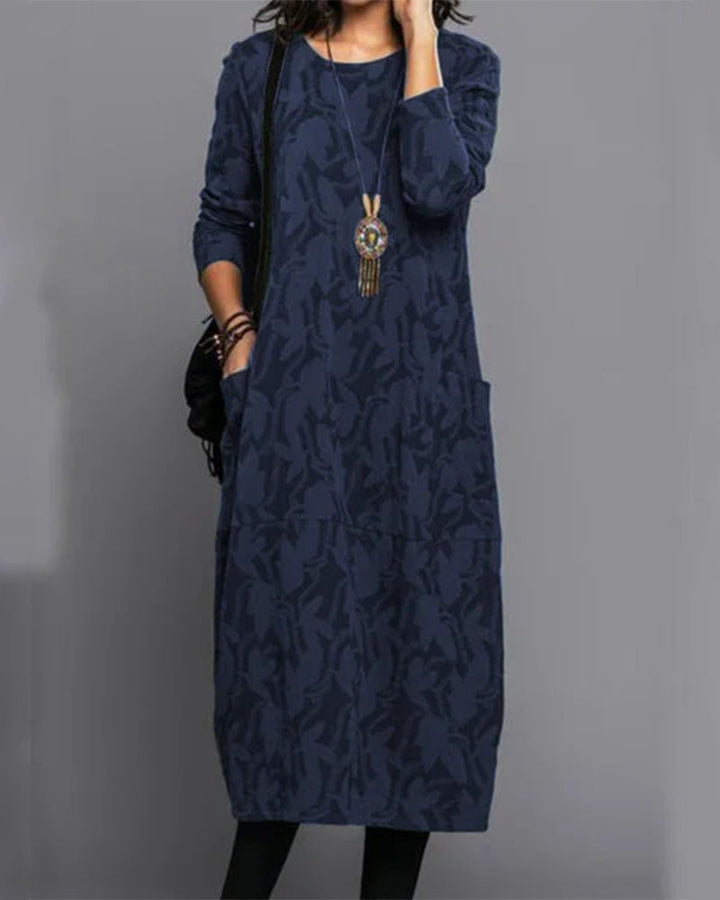 Versatile women's printed long-sleeve midi day dress with pockets for comfort and style. Elegant womenswear.