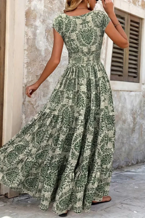 Women's elegant printed V-neck maxi dress, perfect for summer vacations. Flowing, comfortable style.