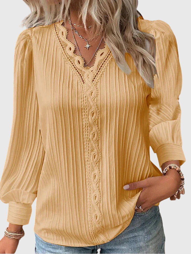 Women's elegant pullover blouse in a chic, versatile design, perfect for office or casual fashion.