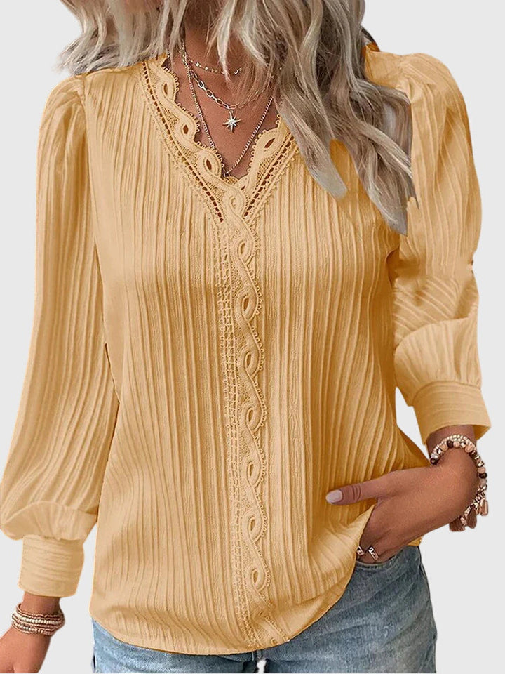 Women's elegant pullover blouse in a chic, versatile design, perfect for office or casual fashion.