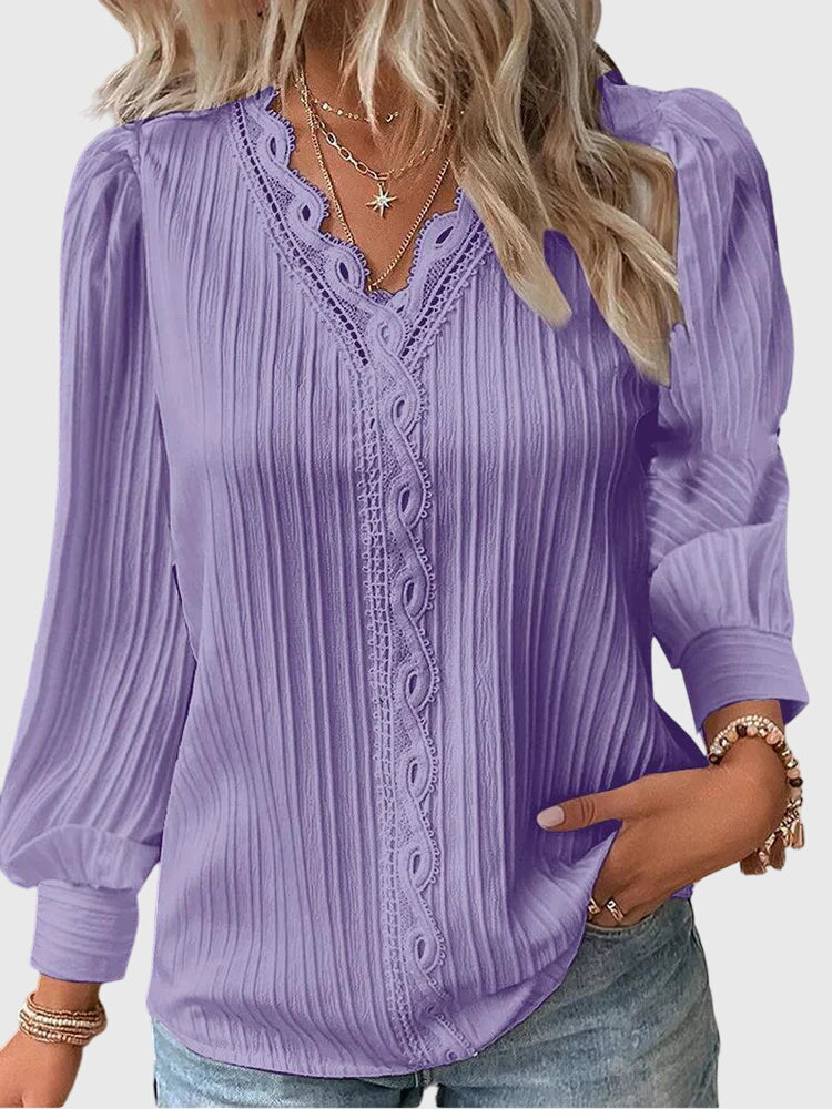 Elegant women's pullover blouse, a professional and stylish top ideal for office or smart casual looks.