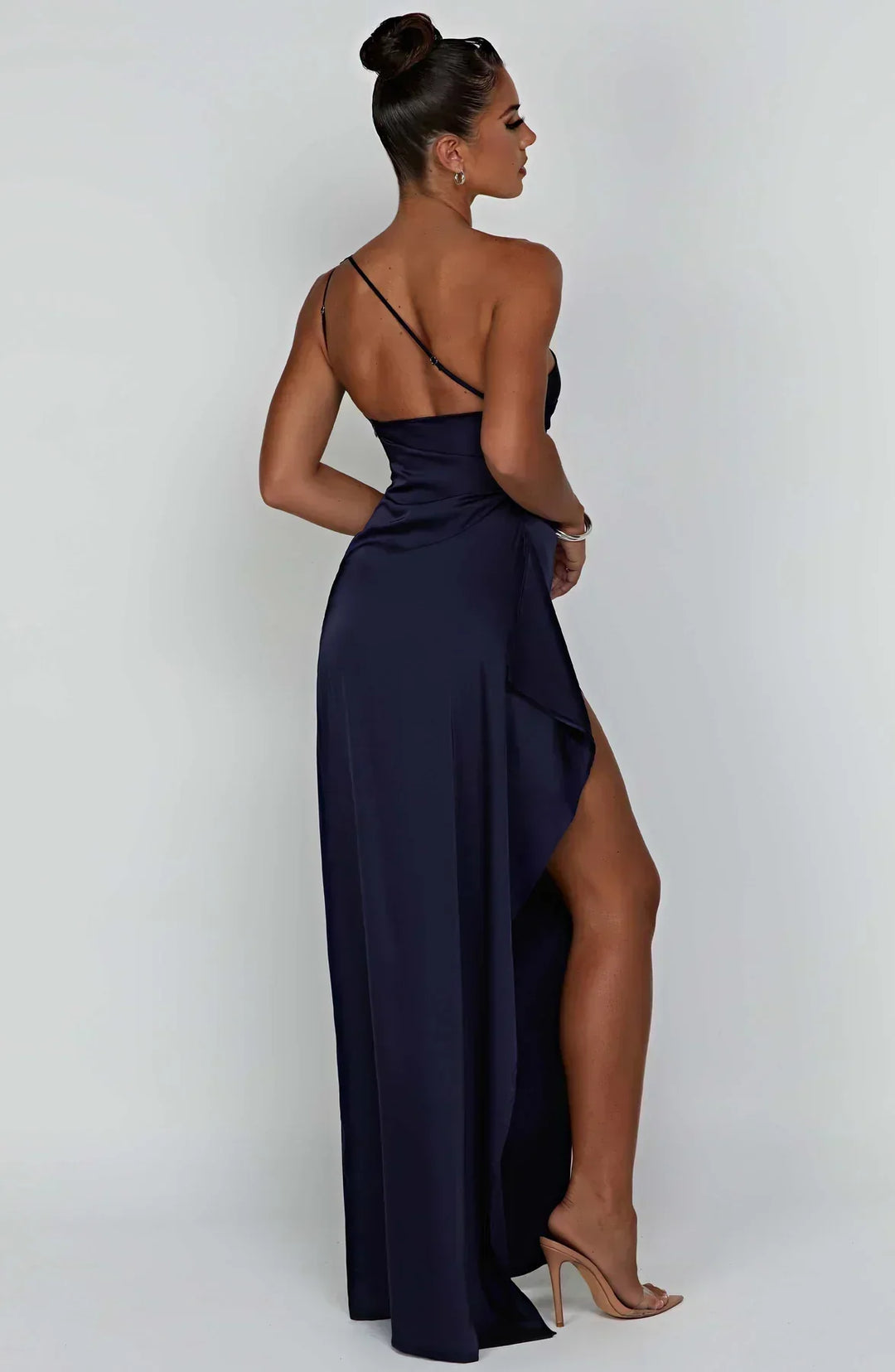Red Selene dress, elegant pleats, and a unique shoulder detail for a stunning look.