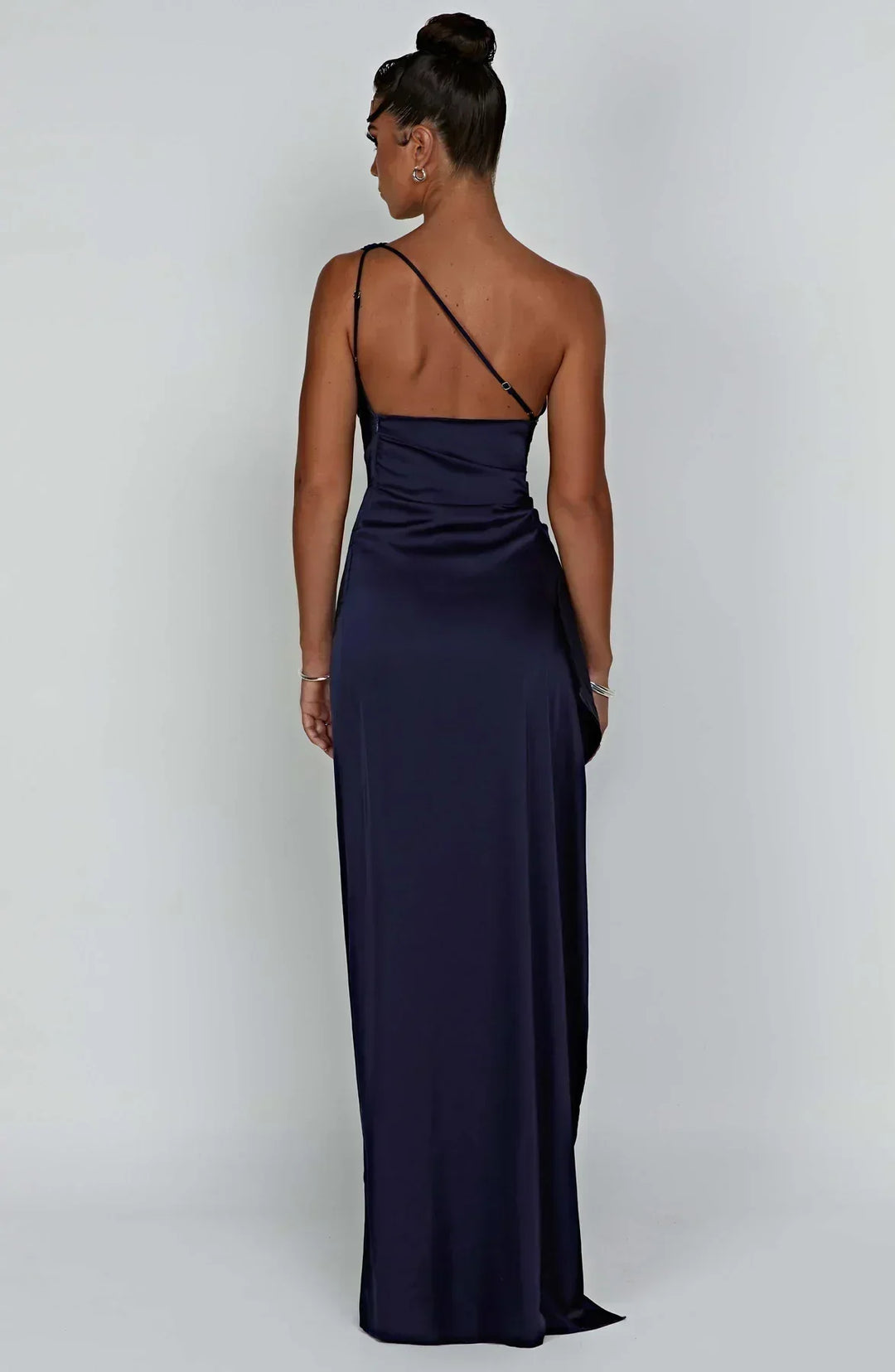 Black satin evening dress, sophisticated pleats, and a graceful unique shoulder feature.