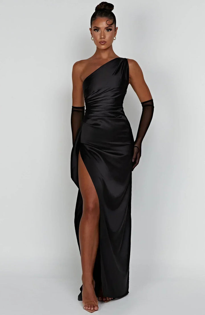 Stylish black special occasion dress, elegant pleats, and a distinctive unique shoulder.