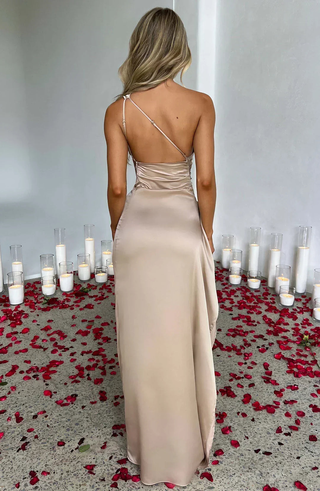 Formal red special occasion dress, elegant pleats and a stunning distinctive shoulder.