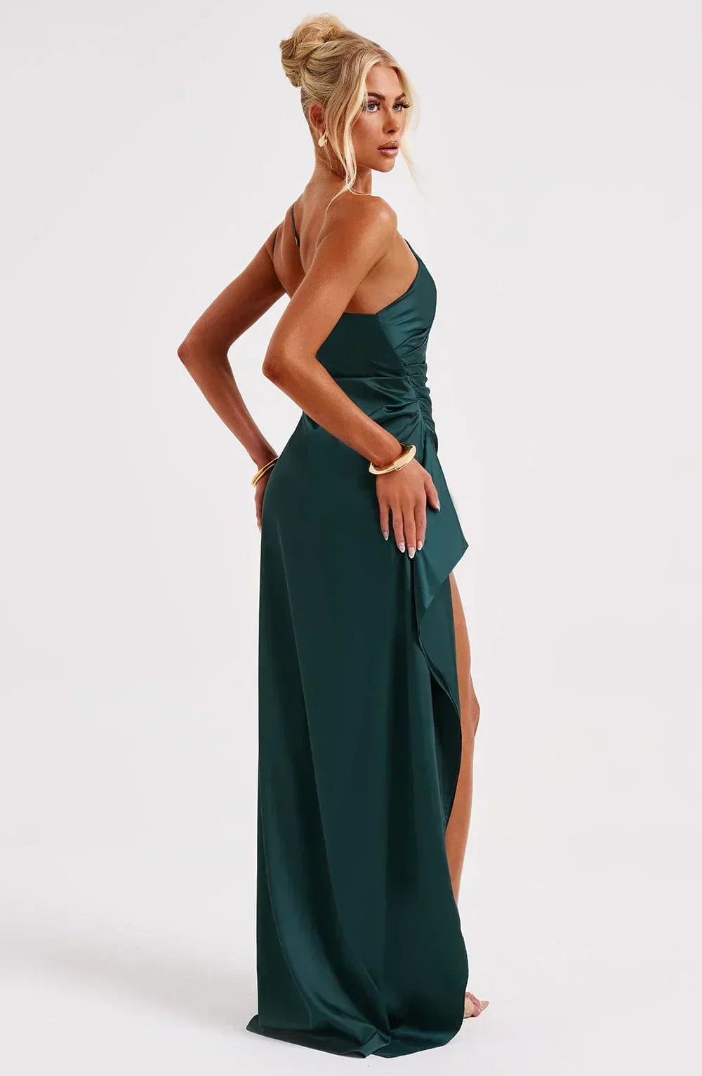 Women's red party gown, unique shoulder, and stylish pleated satin for events.