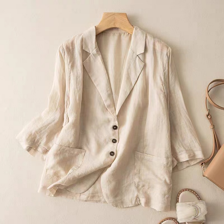 Women's elegant relaxed fit blazer in a versatile apricot shade, perfect for professional or casual wear.