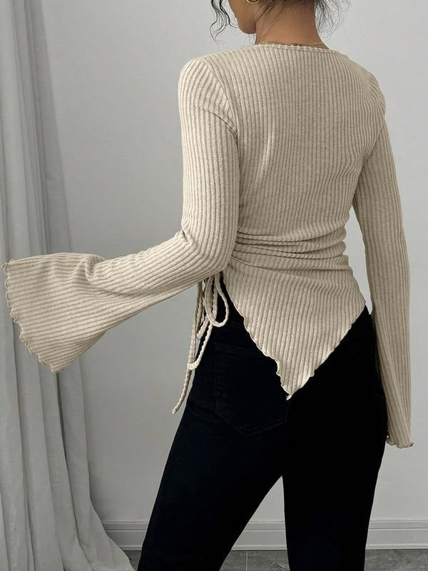Stylish women's long sleeve ribbed knit wrap blouse. A sophisticated top offering a flattering fit for modern fashion.