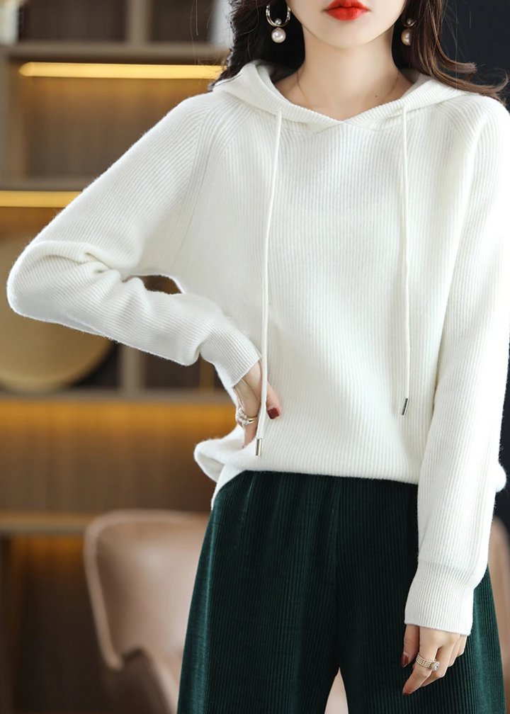 Soft women's elegant ribbed knit hoodie, pullover style, relaxed fit for casual comfort.