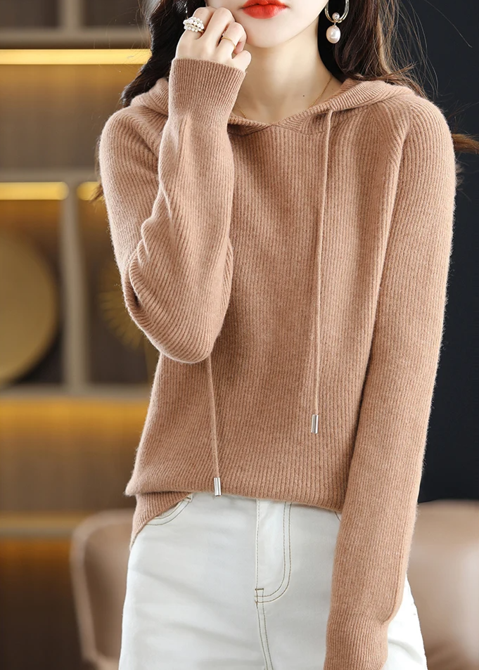 Chic women's ribbed knit hoodie with drawstring, comfortable for winter style.