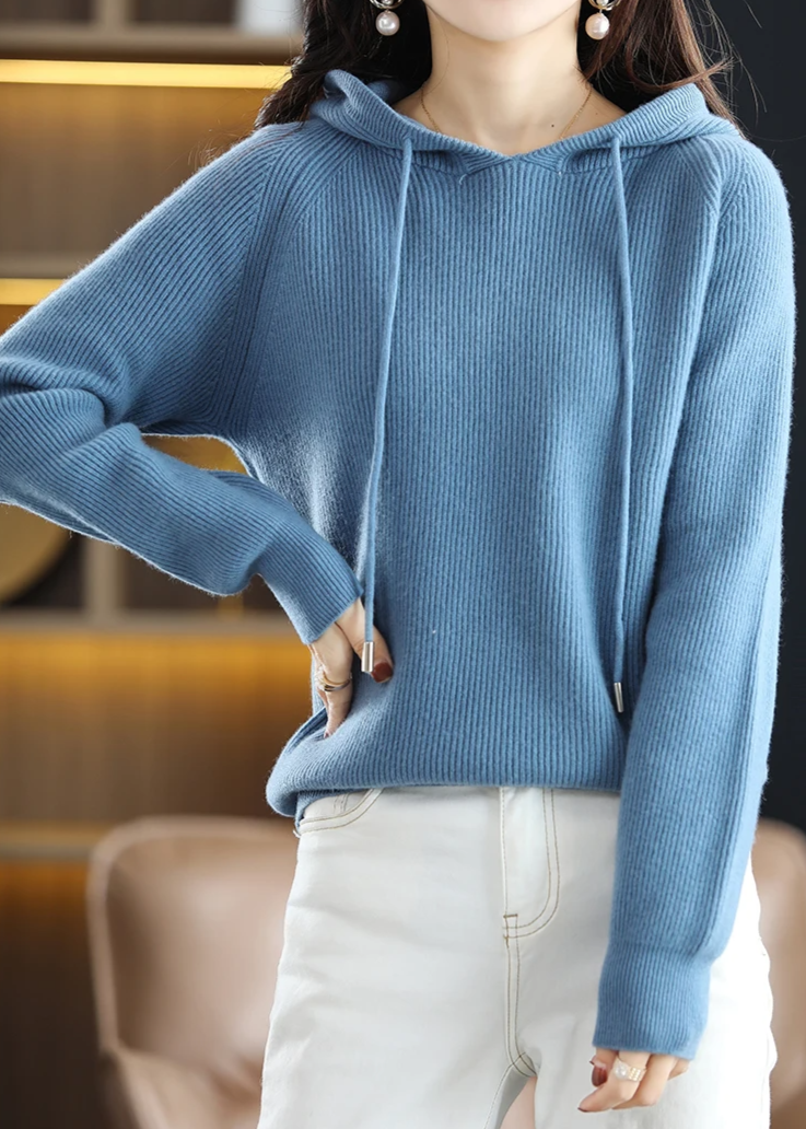 Comfortable women's ribbed knit pullover hoodie, chic and warm for winter layering.