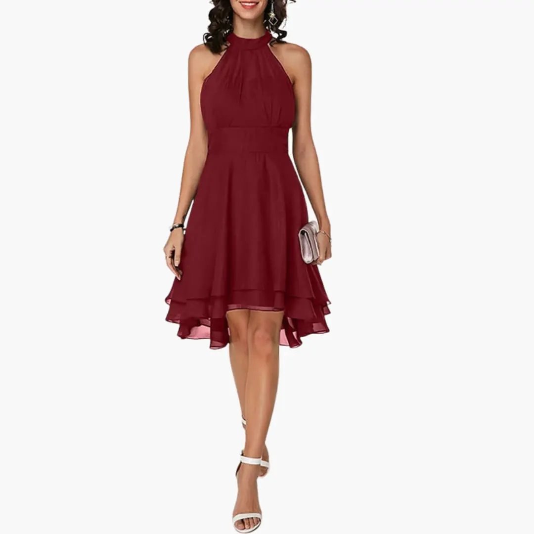 Flowy women's sleeveless ruffle dress with a round neck. This elegant knee-length summer dress is perfect for warm weather.