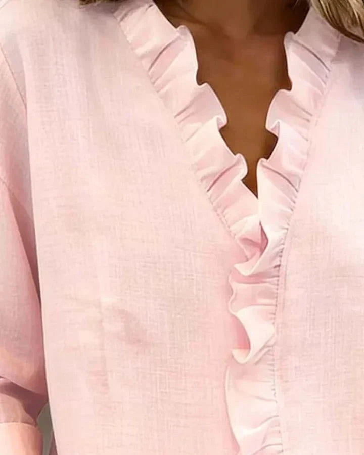 Stylish women's ruffled V-neck long sleeve blouse, ideal for modern elegant fashion.