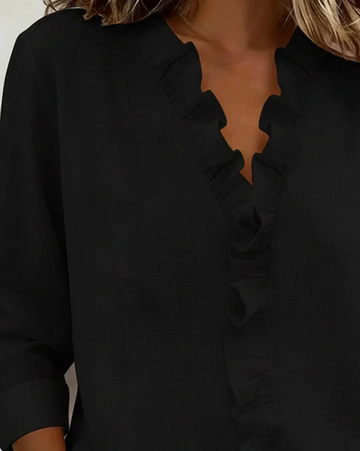 Black elegant women's ruffled V-neck long sleeve blouse, a sophisticated fashion choice.