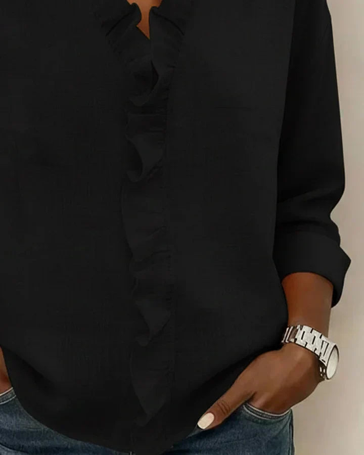 Ruffled V-neck long sleeve blouse for women, offering elegant and versatile style.