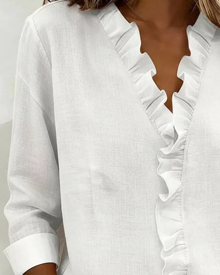 V-neck long sleeve women's blouse with elegant ruffles, a versatile top for any look.