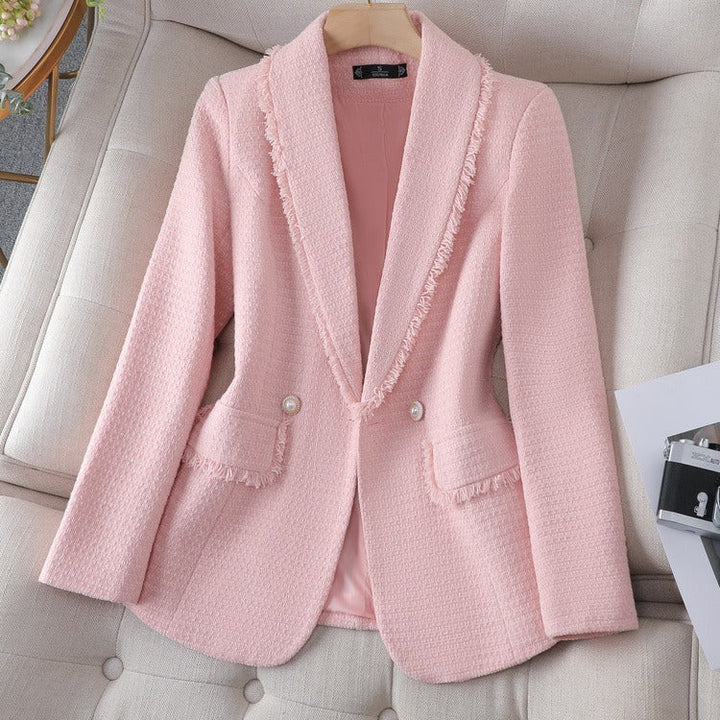 Elegant women's blazer featuring intricate pearl details on a sculpted fit. A chic choice for special occasions & office.