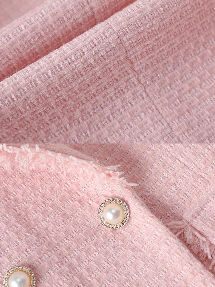 Women's stylish raw edge blazer with elegant pearl detailing. Sculpted fit tailored for a chic professional look.