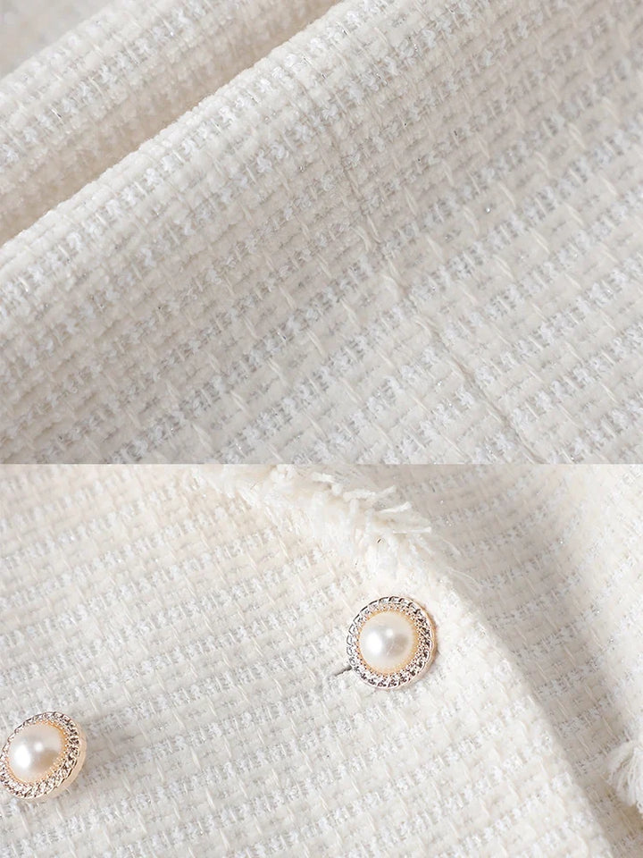 Elegant women's sculpted blazer with pearl details, offering a chic, tailored fit. Ideal for professional settings or special occasions.