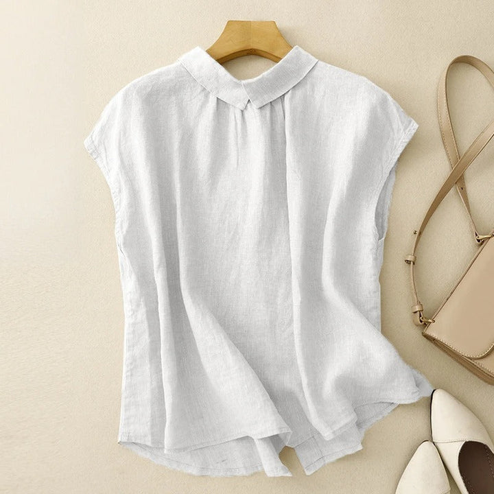 Stylish women's blouse with an elegant sculpted collar, cap sleeves, offering everyday comfort & versatility.