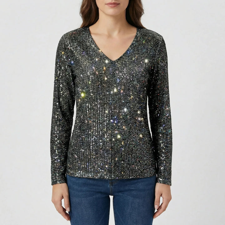 Fashionable women's shimmer V-neck long-sleeve blouse, showcasing its elegant fabric and flattering cut.