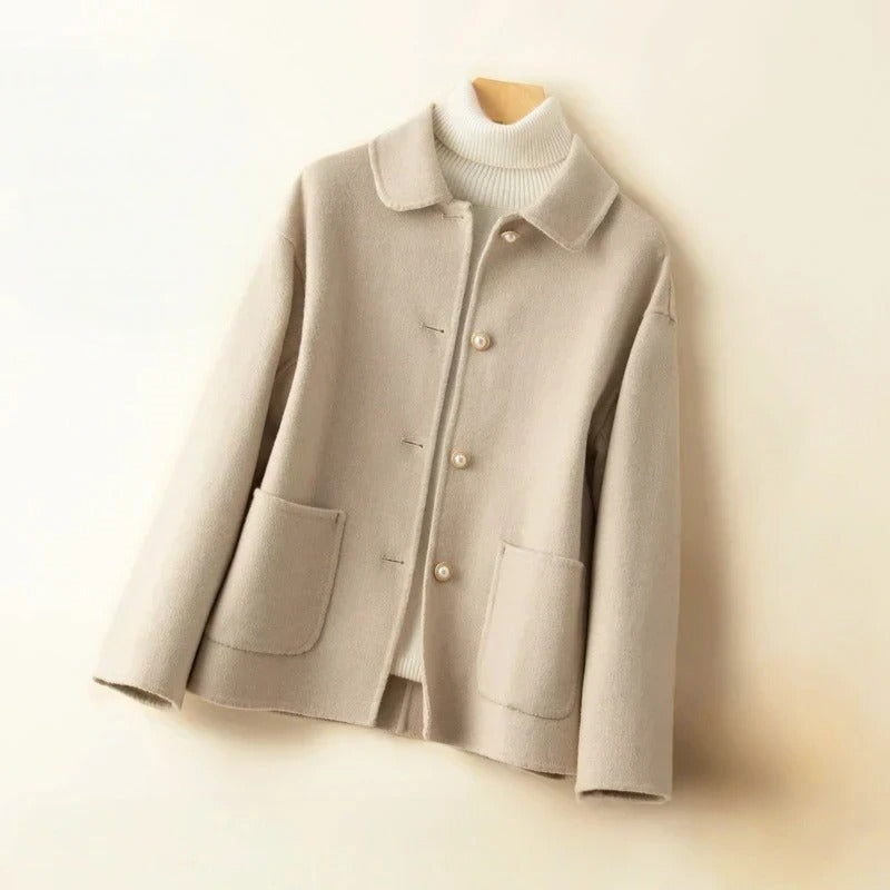 Chic women's short coat for versatile autumn fashion. Elegant outerwear with classic button closure.