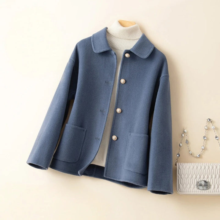 Classic women's elegant short coat for winter warmth & stylish layering. Features button closure & chic design.