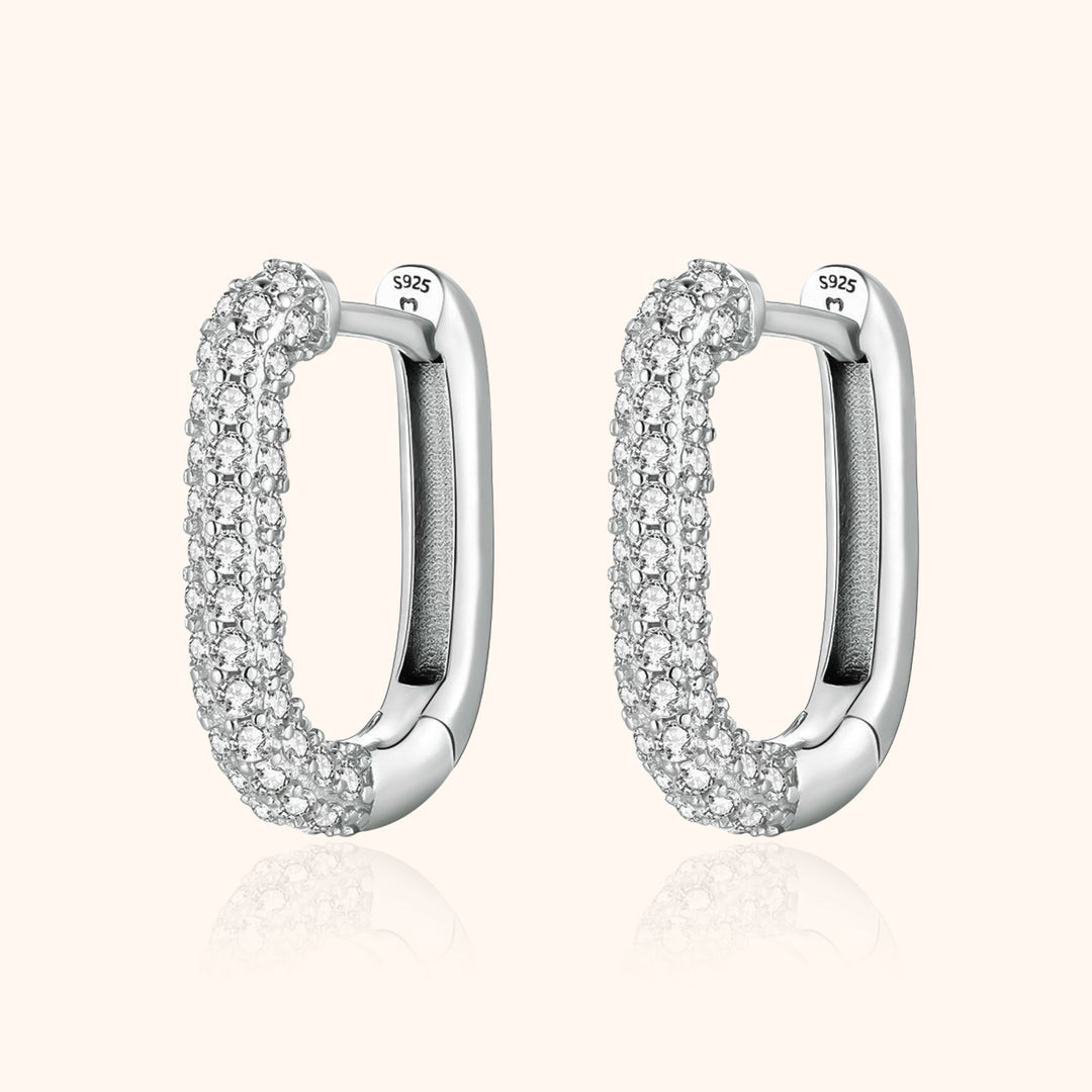 Women's elegant silver & gold hoop earrings with sparkling zirconia stones, part of the Lucienne collection.
